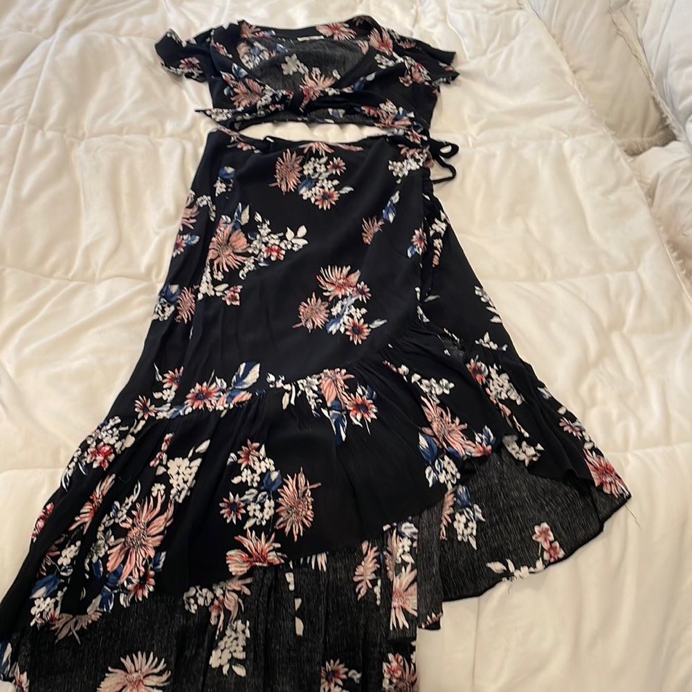 Two-piece high waisted wrap skirt with Tie front top.